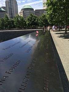 A black plaque with engravings of the names of people who died in the September 11 attacks