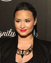 Demo Lovato is looking away from the camera.