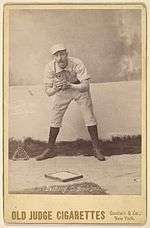 Doc Bushong on an 1888 Old Judge baseball card, showing glove.