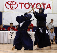 Dong Jin Kim sensei (back facing camera) in the 2008 Kendo championship match vs. Mikio Koga sensei.png