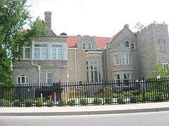 Large gated stone mansion