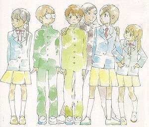 A group of six junior high school students standing side-by-side in school uniforms. From the left is a girl, two boys, a girl wearing a male uniform, and two other girls