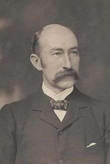 A black and white portrait of H. B. Higgins