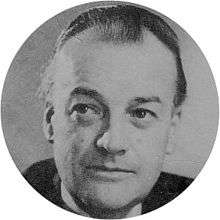 head and shoulders shot of a middle-aged man, slightly balding