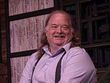 Old white man with a smile on his face