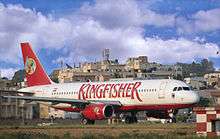 Airport terminal with aeroplane labelled "Kingfisher"