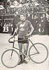 A picture of Louis Darragon beside his bike.