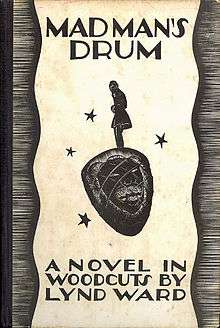 A book cover with a black-and-white illustration of a man standing atop an African drum with the image of a face on it.  The title at the top reads "Madman's Drum", and at the bottom reads "A novel in woodcuts by Lynd Ward".