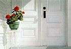 striking photo-realistic oil painting of white porch with double-doors, geranium plant on white stand