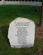 a roughly edged flat grey stone inscribed with the names of the women murdered, and dedicated by the engineering community at McMaster