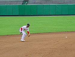 Baseball great is seen fielding a ground ball on a dirt infield