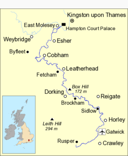 Map of the River Mole, marked in dark blue, running in an S-shape. Towns and some villages are named. At the top of the map, a stretch of the River Thames between Weybridge and Kingston is shown in light blue.