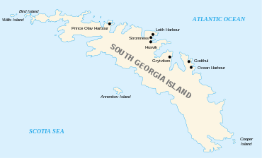 Outline map of the island of South Georgia and several offshore islands. South Georgia has a long irregular shape with many coves and deep bays. On the north shore the main whaling stations are marked: Prince Olav Harbour, Leith Harbour, Stromness, Husvik, Grytviken, Godtul and Ocean Harbour.