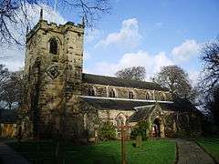 A church with a battlemented west tower