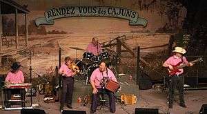 Lesa Cormier and the Sundown Playboys at the Liberty Theater in 2003. All members are wearing pink.