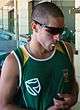 A South African cricketer wearing green shirt and sunglasses.